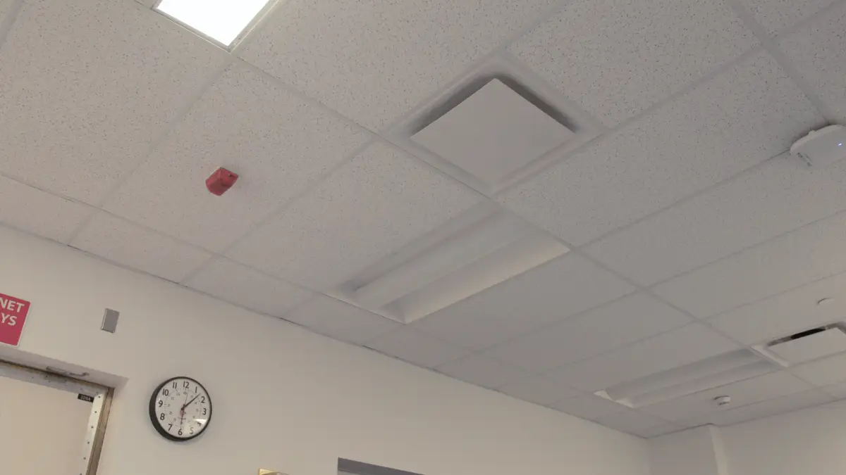 To reduce duct-borne noise transmission, consider rerouting existing HVAC ducts or installing dampers and sound attenuators within the ductwork. Additionally, selecting air diffusers designed for acoustic performance can further minimize noise levels in the control room and other sensitive areas.